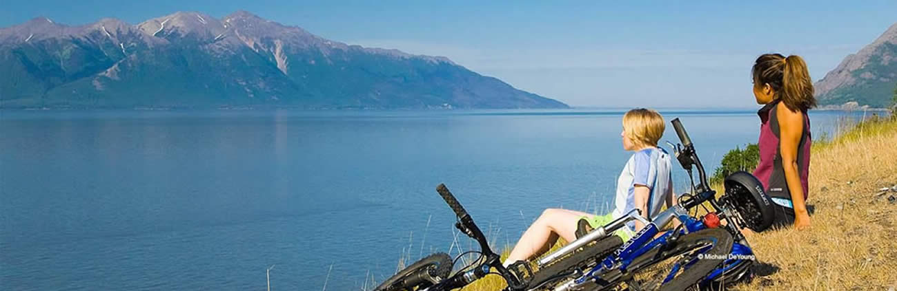 Women sitting by lake thinking about getting LASIK