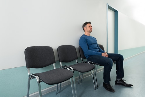 man sitting in waiting room