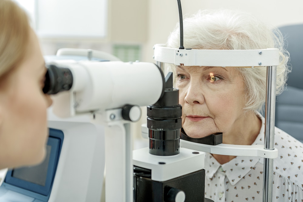 Woman at an eye exam during refractive lens exchange consultation.